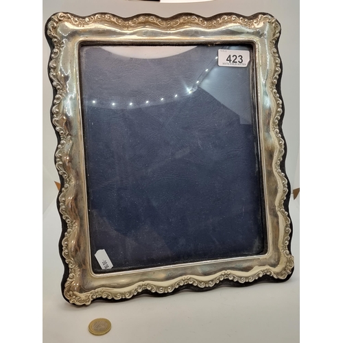 423 - A sterling silver (hallmarked Sheffield) glazed and velvet lined photo frame, with internal measurem... 