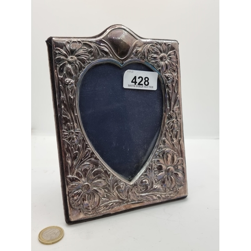 428 - An attractive sterling silver heart shaped glazed photo frame. Hallmarked London. Internal dimension... 