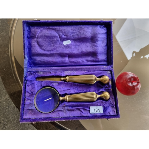 781 - A fantastic brass letter opening set, comprising of a magnifying glass and letter opener, with lovel... 