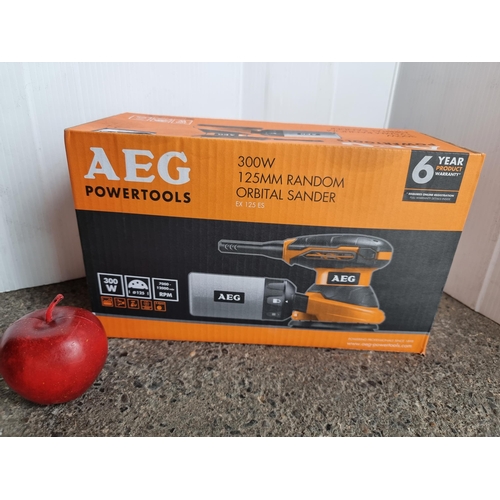 786 - An AEG 300W 125MM Random Orbital Sander. Unused, in original box.