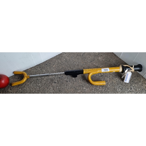 789 - A Promagii anti theft car steering wheel lock with key.