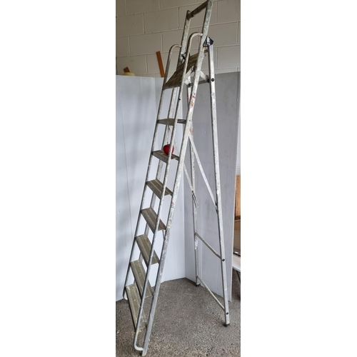 794 - A foldaway A-frame step ladder with eight steps.