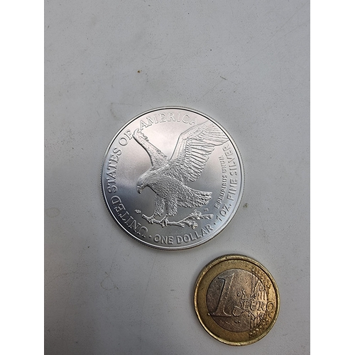 9 - A United States one Dollar American silver Eagle, dated 2021 and type two. The weight of the coin is... 