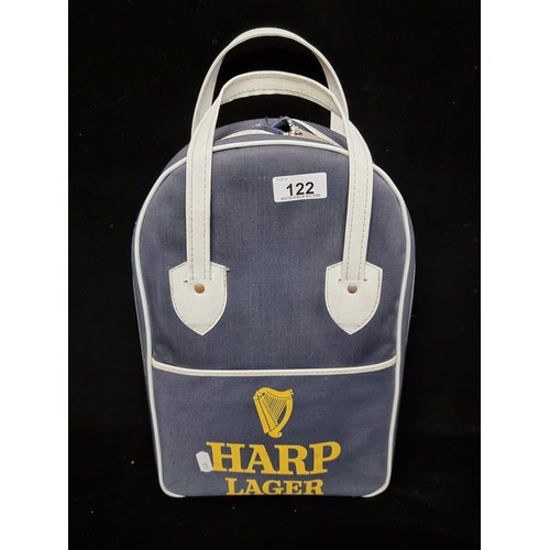 122 - A vintage 1970s Harp Lager branded picnic set consisting of plates, cups, cutlery and salt and peppe... 