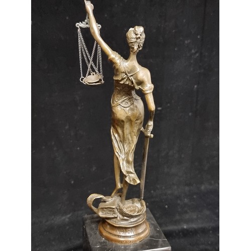 145 - Star Lot : A super heavy bronze figure of Lady Justice, defiantly brandishing her scales and sword a... 