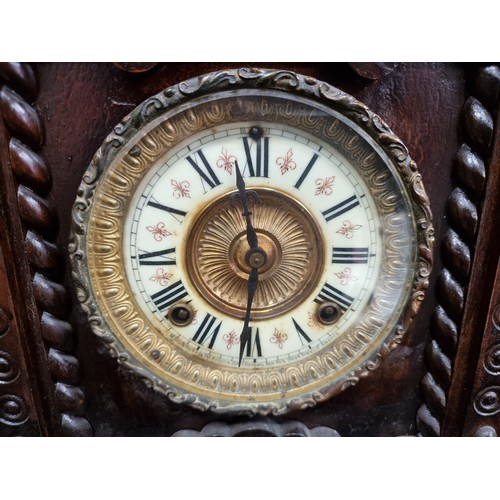 153 - A beautiful eight-day antique mantle clock by Ansonia, in the Norwich design. With a porcelain face ... 