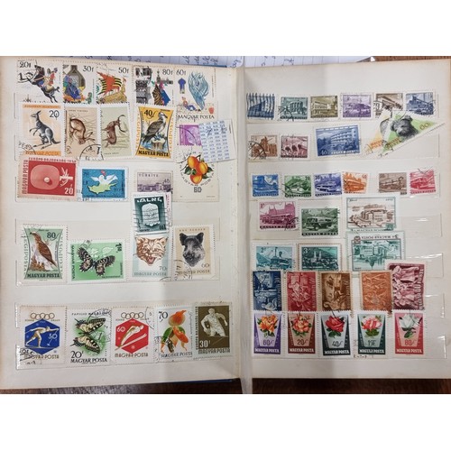 203 - Two beautiful vintage stamp albums, both filled completely with International stamps from countries ... 