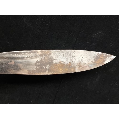 204 - A handsome and very large Kukuri knife. Fitted with a very ornately beaded scabbard and aluminium hi... 