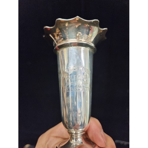 236 - A pair of sterling silver bud vases hallmarked Birmingham 1928 & 1934 respectively. With fluted rims... 