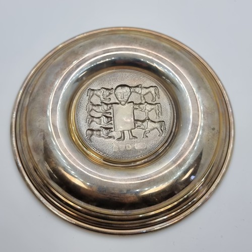 404 - An Irish silver embossed Dublin dish depicting a Celtic design of a Shepherd and his flock by Dougla... 