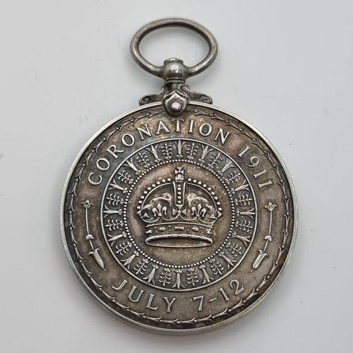 406 - A Sterling Silver George the Fifth Coronation medal, circa 1911. In super fine condition. Weight of ... 