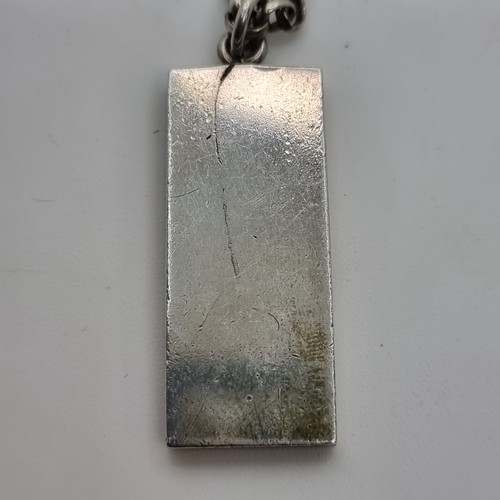 409 - An interesting sterling silver ingot, hallmarked Birmingham. With chain length: 46cm and a total wei... 