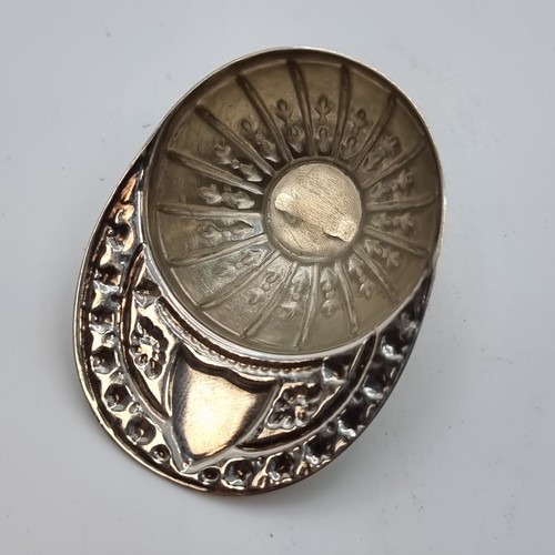 412 - A sterling silver jockey cap with blank cartouche to rim. Hallmark is Sheffield, makers mark W.W She... 