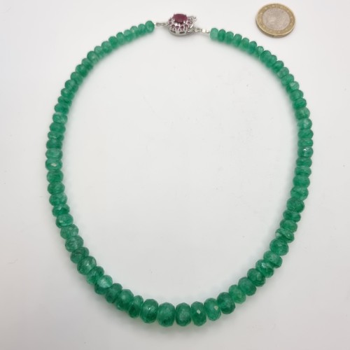 357 - A stunning graduated Emerald necklace (112 total carats) with a ruby (3.2cts ) clasp set in sterling... 