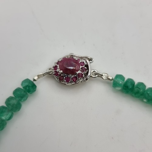 357 - A stunning graduated Emerald necklace (112 total carats) with a ruby (3.2cts ) clasp set in sterling... 