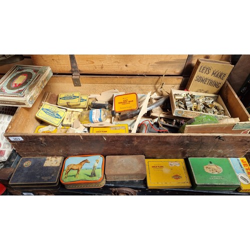 363 - A hinged wooden vintage box filled with large quantity of vintage items with lots of branded cigaret... 