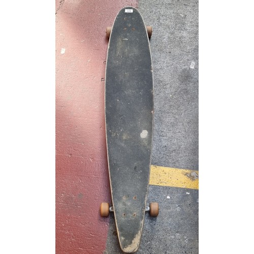 328 - A vintage 1980's Santa Cruz long board with original tracks and timber body.