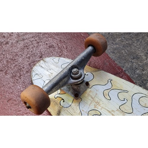 328 - A vintage 1980's Santa Cruz long board with original tracks and timber body.