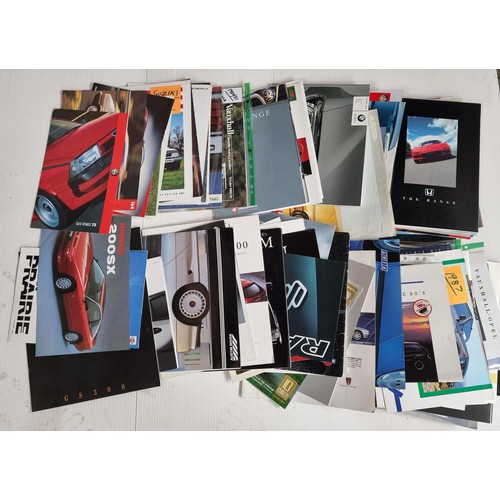 807 - A large collection of over 100 classic car sales brochures including Porsche 1988 range, Alpha Romeo... 