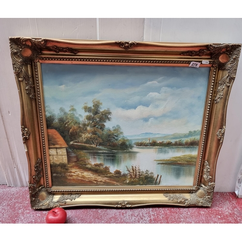 279 - A very large original oil on board showing a picturesque countryside landscape. The work is signed i... 