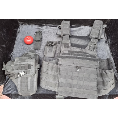 A collection of four pieces of matching tactical body gear for Airsoft purposes by Military 1st (MFH) brand. Including a padded vest, holster belt and two more accessory attachments. In a high quality durable material. - Unused