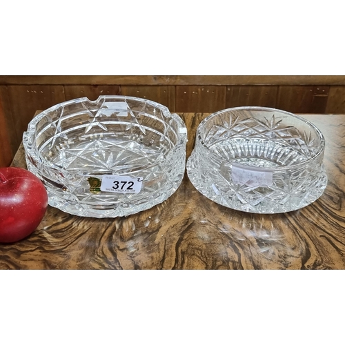 372 - Two large cut crystal ashtrays including one Waterford and one Dublin Crystal example.