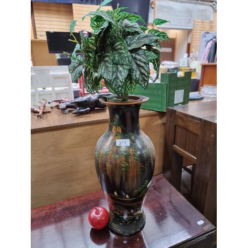 396 - A nice tall hand painted Chinese vase with artificial plant included. The vase features mountainous ... 