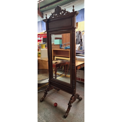 400 - An absolutely stunning standing bevelled dressing mirror with an elaborate carved frame, clawed feet... 