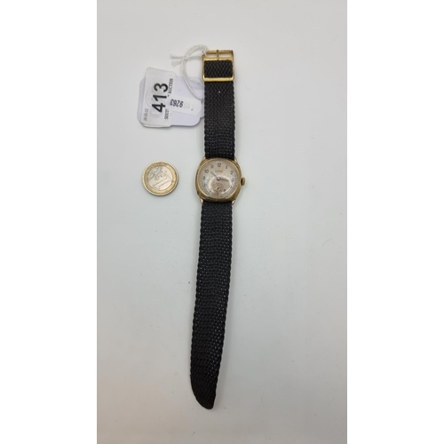 413 - A vintage Roamer wristwatch with engine turned dial face and second hand, with strap. In working ord... 