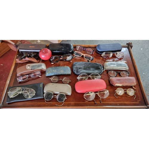 610 - A large bag of fourteen antique and vintage glasses / spectacles. Including a pair of modern Hugo Bo... 
