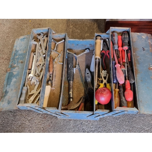 626 - A vintage metal articulated toolbox filled with an assortment of tools including screwdrivers, wrenc... 