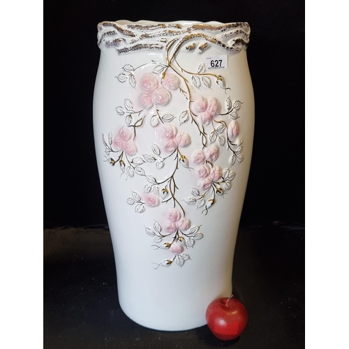 627 - A very large ceramic vase with pink roses in high relief and hand gilt branches. Mm: 53 cm