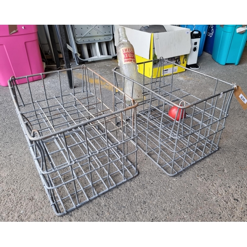 636 - Two fabulous 1950's galvanised motor oil bottle crates. Including one large Shell oil bottle.