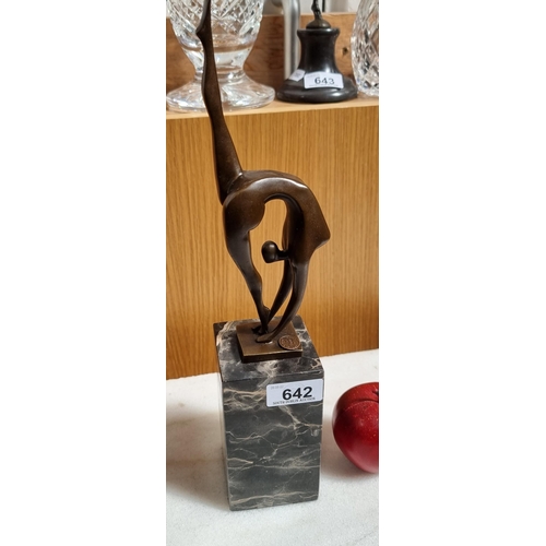 642 - A very striking bronze sculpture of a stylized female gymnast preparing to flip, after Miguel Fernan... 