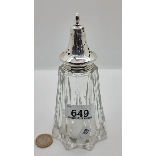 649 - A nice example of a sterling silver topped cut glass sugar shaker. Hallmarked London, circa 1931 and... 