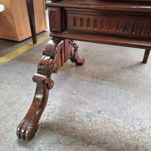 400 - An absolutely stunning standing bevelled dressing mirror with an elaborate carved frame, clawed feet... 