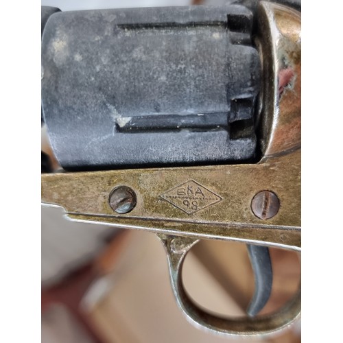 619 - A replica BKA98 percussion revolver along with a genuine leather holster. Good weight and action wor... 