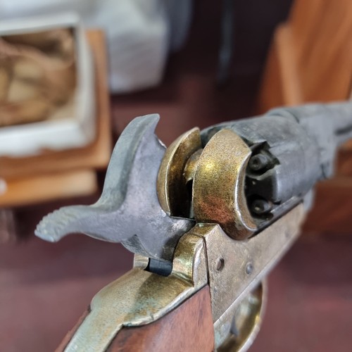 619 - A replica BKA98 percussion revolver along with a genuine leather holster. Good weight and action wor... 