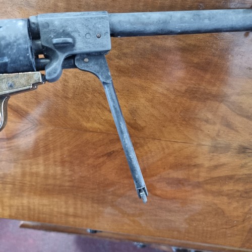 619 - A replica BKA98 percussion revolver along with a genuine leather holster. Good weight and action wor... 