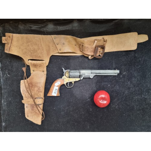 619 - A replica BKA98 percussion revolver along with a genuine leather holster. Good weight and action wor... 