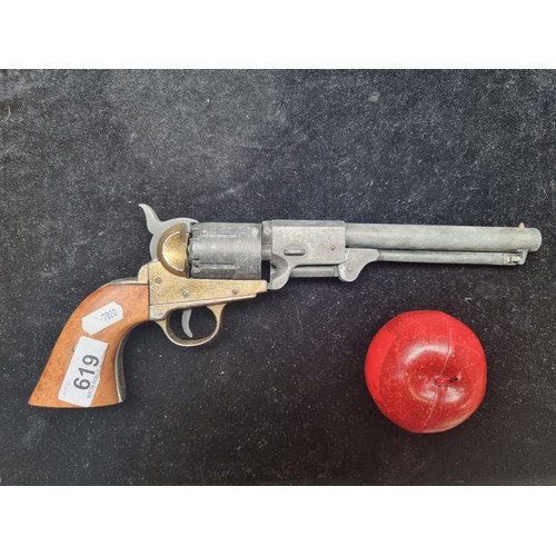 619 - A replica BKA98 percussion revolver along with a genuine leather holster. Good weight and action wor... 