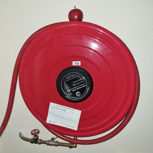 115 - Long wall mounted Fire hose  with in date Maintenance record.