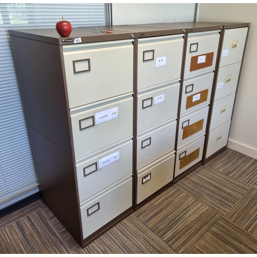 121 - Four nice and clean Triumph 4 drawer file cabinets. In coffee and cream. Located down stairs in trai... 