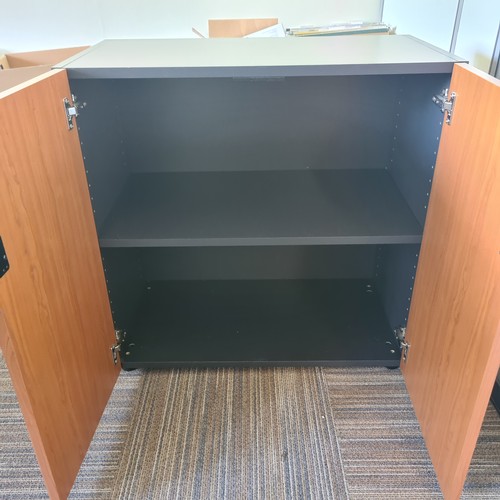 91 - Exectutive office furniture. Curved large desk, matching side table and similar two door cabinet. Su... 