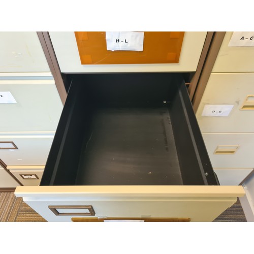 121 - Four nice and clean Triumph 4 drawer file cabinets. In coffee and cream. Located down stairs in trai... 