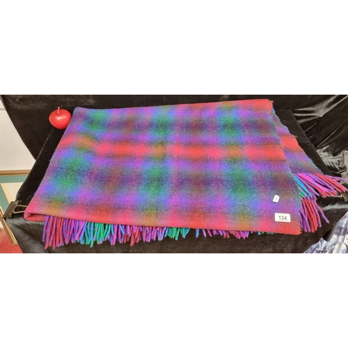 134 - A stunning blanket by luxurious Irish brand Foxford; crafted from pure wool in vibrant shades of cob... 