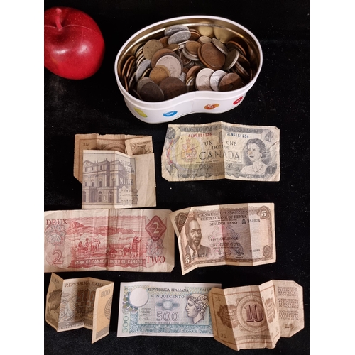 150 - A large tin filled with a wonderful selection of vintage coinage of mostly African origin. Including... 