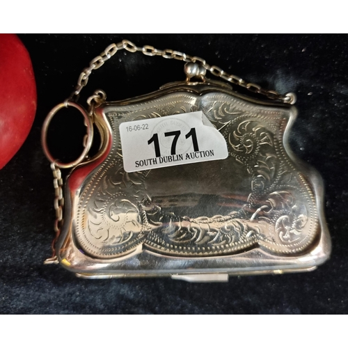 171 - A charming EPNS coin purse, with incised decoration throughout and kiss lock mechanism. With chain a... 