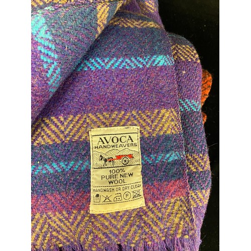 Two beautiful 100 Irish wool blankets, one in purple handmade from Avoca, and a red and black tarta