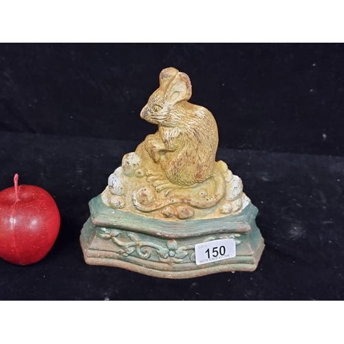 150 - A very heavy antique cast iron door stop in the form of a charming door mouse with perched paws and ... 